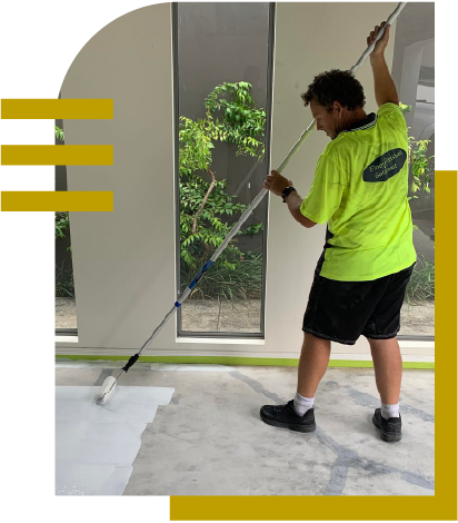 Local epoxy specialist Andrew applying a premium industrial-grade concrete floor coating to a residential garage